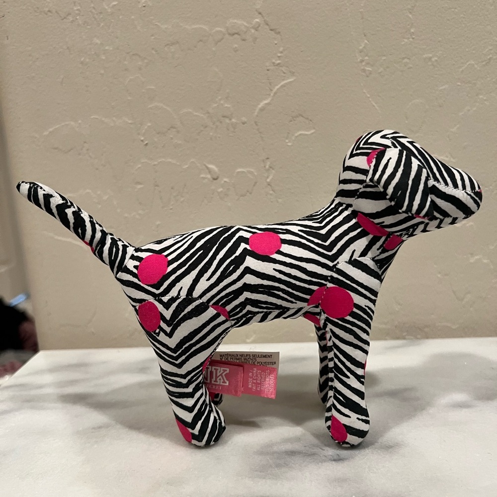 Pink zebra plush dog